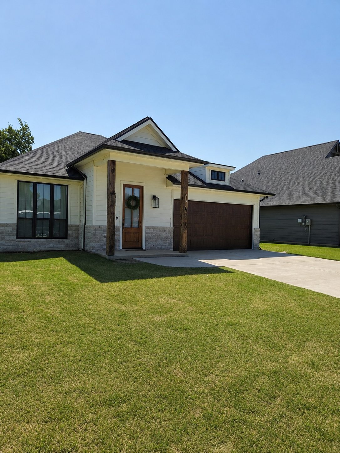 Cream gutters on a modern ranch, matched to the fascia.